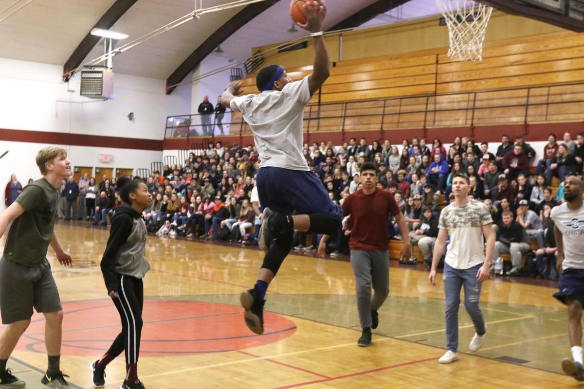  Flight Squad playing basketball with kids
